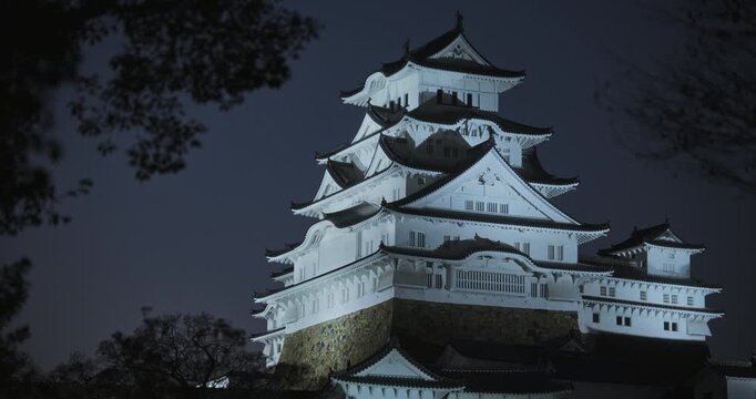 Glowing, white 16th century Matsumoto castle at dusk