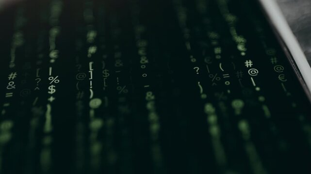 Cascading green alphanumeric characters and symbols on a dark screen
