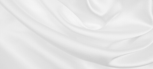 Smooth elegant white silk or satin luxury cloth texture as wedding background. Luxurious background...