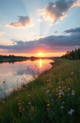 Obraz premium Sunset over wide river, reflecting golden sunbeams. Wildflowers and green grass grow on the steep bank. Trees line distant shore under colorful cloudy sky.