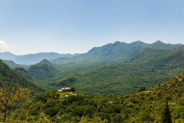 Obraz premium Montenegro Mountain Landscape Near Petrovac with Lush Green Forest Valley