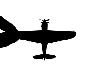 指でつままれたシルエットのプロペラ戦闘機