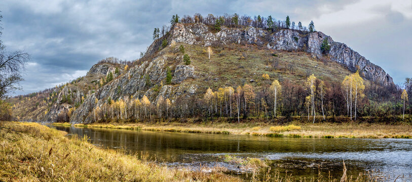Magnificent landscape of the Ural river Belaya with rocky banks on an autumn day