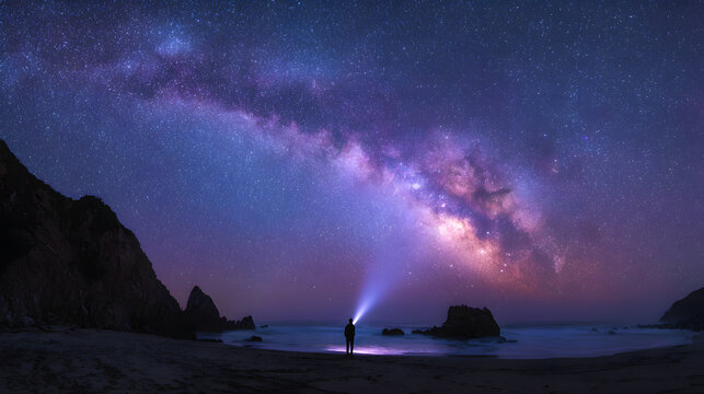Person with flashlight under starry sky