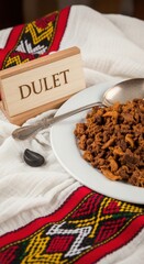 Traditional Ethiopian Dulet Minced Offal Stew with Berbere on Red Border Shemma