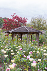 A wooden pavilion in the middle of garden during the daytime at Ashikaga Flower Park
