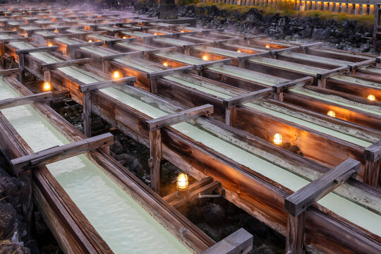 Wooden conduits to transport natural hot spring water at Yubatake (Hot Water Field). Kusatsu Onsen, Agatsuma, Gunma, Japan.