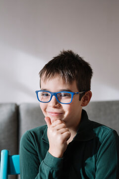 Portrait of smiling boy wearing blue glasses