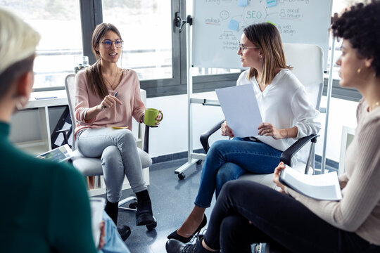 Businesswomen during meeting at a flipchart