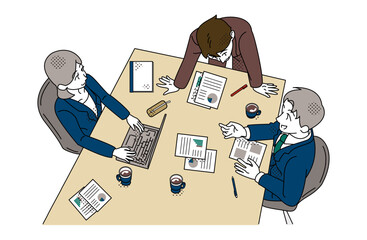 Business Team Meeting Discussion Around Table With Reports and Laptop