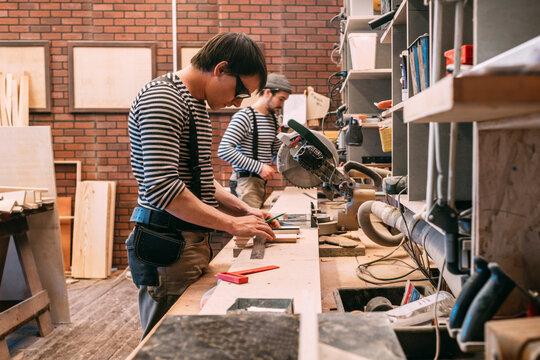 Carpenters at work in a workshop