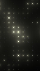 Obraz premium Abstract dark background with soft golden star-like light flares, creating an elegant, cinematic atmosphere of sparkle and luxury