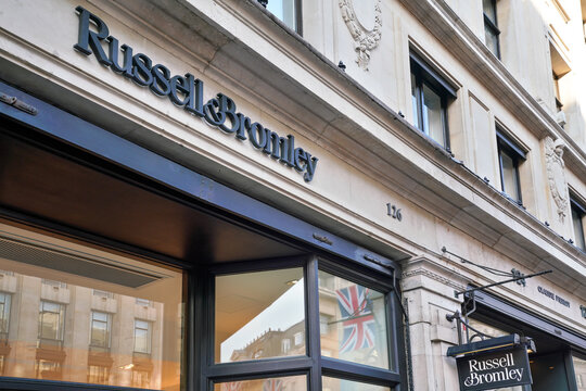 London, United Kingdom - May 20, 2023: Russell and Bromley logo on their store at Regent Street. It is British luxury footwear and handbag brand established in 1873