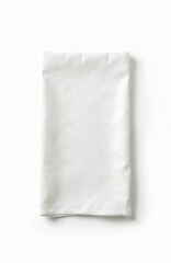 Fototapeta premium Plain white cotton napkin is neatly folded. This textile lies on a bright white background. It is suitable for culinary use in restaurants or home.
