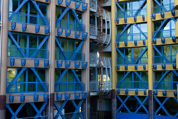 Fototapeta premium Detail of the facade of a modern building with blue metal structures