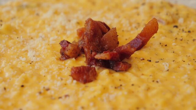 Risotto carbonara texture, delicious twist on the famous first course made with egg yolks, pecorino, and guanciale. High quality 4k footage