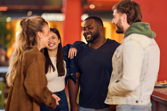 Friends Gather and Laugh Together in a Casual Night Hangout