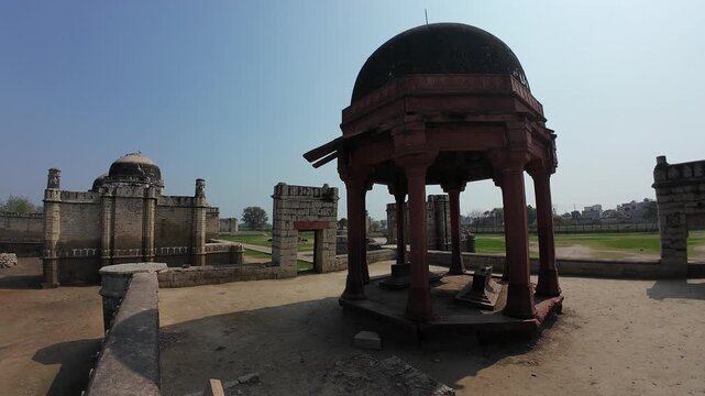 Ancient burial site and memorial monument of a local medieval ruler Family in Jhajjar showcasing intricate red sandstone masonry and Islamic design