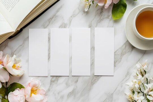 Minimal Easter mockup with four blank vertical bookmarks on marble background, open book, pastel spring flowers and tea cup, elegant flat lay, bright natural light, clean copyspace