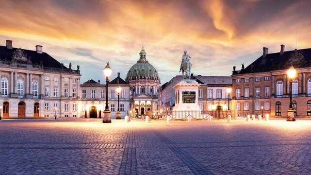 Time lapse of Copenhagen - Beautiful fountain at the Royal Danish Palace Amalienborg at dramatic sunrise. Royal residence, Denmark