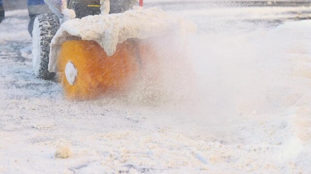 Removing snow with portable blower machine during winter, worker with gas snow blower removal in the streets after snowfall, clearing residential sidewalk driveway with snow sweeper, snowplow machine