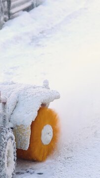 Removing snow with portable blower machine during winter, worker with gas snow blower removal in the streets after snowfall, clearing residential sidewalk driveway with snow sweeper, snowplow machine