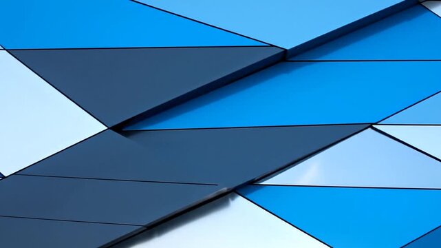 Geometric Blue Abstraction: A captivating interplay of geometric shapes, showcasing triangles and diamonds in varying shades of blue, creating a mesmerizing abstract design. 