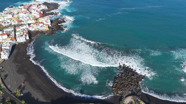 Aerial of closed beach with red flags and warning signs due to E. coli contamination and sewage discharge in Tenerife