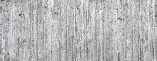 Fototapeta premium Gray concrete wall showing weathered wood grain texture