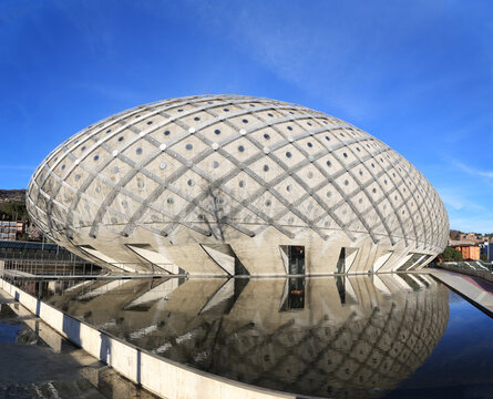 Chiasso, Switzerland - March 15. 2023: The Centro Ovale shopping mall, also called Silver Egg, a landmark in Chiasso, Ticino. It was opened in 2011 and it becomes a Dead Mall since Dezember 2015.