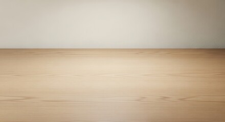 Naklejka premium Clean light wood tabletop with soft overhead lighting and empty space for natural home product photography and minimalist interior design mockups