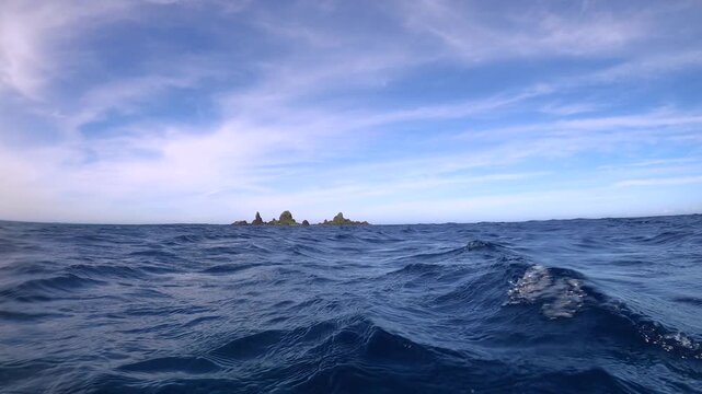 Slow motion of Still View looking straight to worship Rock with choppy Rippling ocean water waves in front and look out to Horizon during good days good weather sunshine daytime in Lanyu orchid island