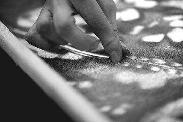 Close Up Fingers Creating Lines In Fine Sand Texture