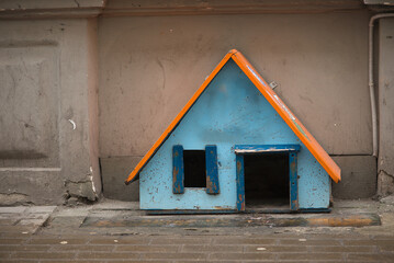 Small Colorful Cat Shelter House In Urban Environment