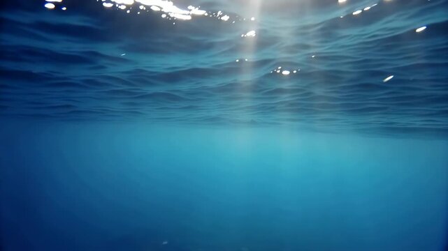 Mesmerizing ocean surface with sunlight rippling through clear blue water for backgrounds and visual effects