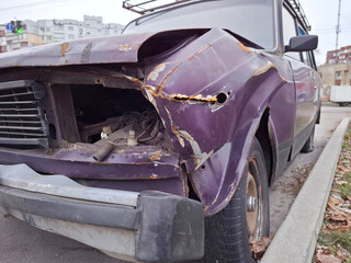 The vehicle is heavily damaged after the road crash.Car after road accident