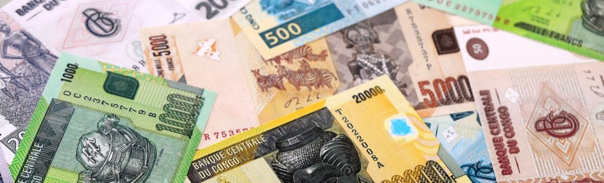 CFA franc money bills pile on table. Republic of the Congo banknotes of XAF currency close up.
