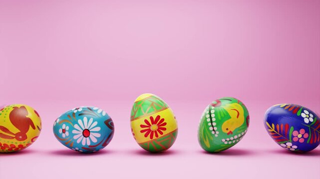 Hand painted easter eggs rolling in a seamless loop on a pink background.