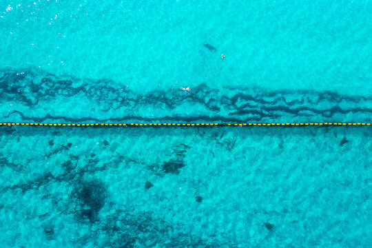 Swimmers enjoy the turqoise waters off Perth's Coogee Beach, just south of Fremantle, Western Australia.