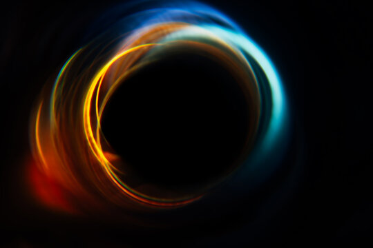 abstract yellow-blue glowing circle on a black background