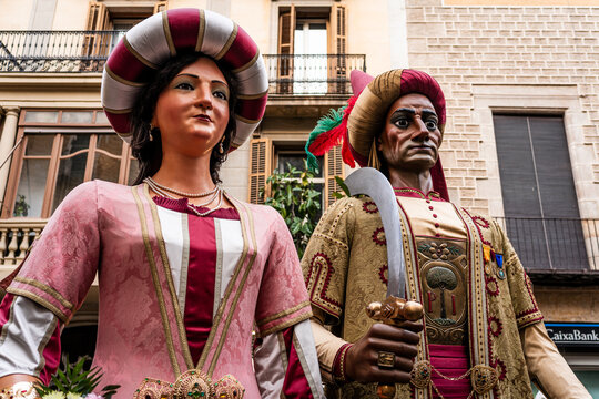 Barcelona, Spain - 18 february 2026: traditional catalan Gegants del pi are seen dancing in the crowd during a popular folklore parade