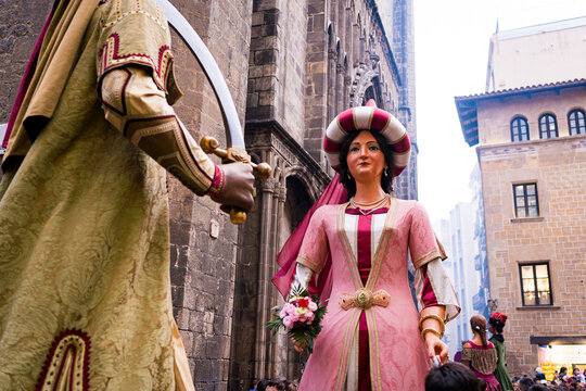 Barcelona, Spain - 18 february 2026: traditional catalan Gegants del pi are seen dancing in the crowd during a popular folklore parade