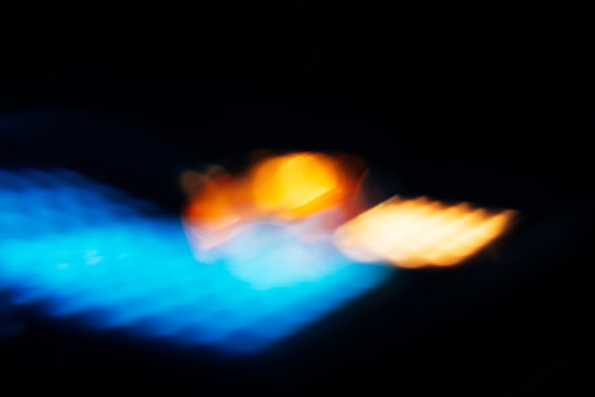 blue light flare with yellow and orange flashes, overlay effect