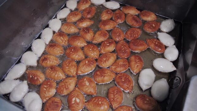 The Traditional Process Of Frying Batata Vada