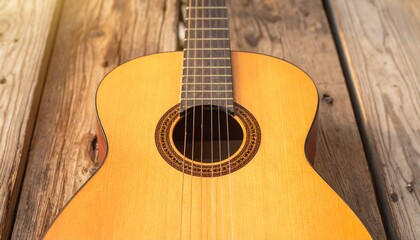 Fototapeta premium Acoustic Guitar on Rustic Wooden Plank Surface with Warm Lighting