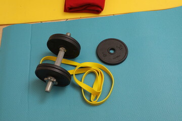 Fitness equipment for home workout on yoga mat