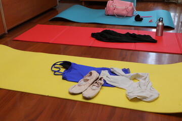 Dance and fitness equipment on colorful yoga mats
