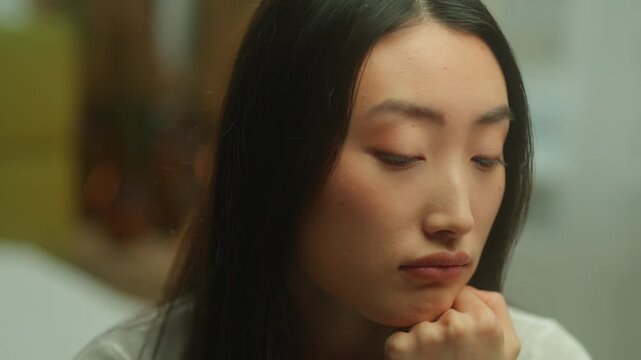 Portrait thoughtful lonely Asian Korean woman feeling sadness frustration grief at home alone Chinese Japanese girl lady female stressed thinking psychological anxiety depression desperate boring