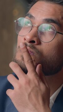 Close up thoughtful puzzled Hispanic businessman Arabian business man thinking Indian leader startup owner CEO think male guy pondering idea planning strategy unsure hesitate doubt question in office