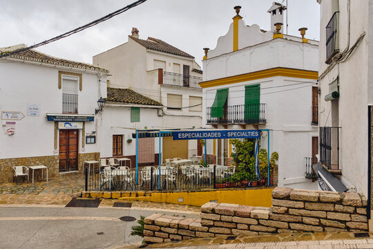 GAUCIN, SPAIN: Street scene in Gaucin Andalucia Spain a restaurant with outdoor seating and traditional white buildings The charm of a Spanish village, in the aftermath of heavy rainfall